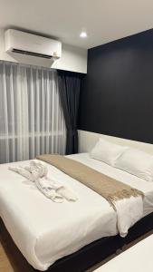 Ένα ή περισσότερα κρεβάτια σε δωμάτιο στο The1 Ratchaphruek I วิวเมืองนนทบุรี +32 φωτογραφίες