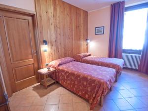 Postel nebo postele na pokoji v ubytování Residence Hotel Moderno
