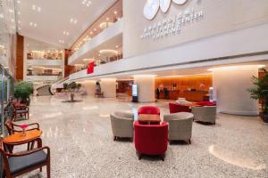 a lobby with chairs and tables in a building at Kai Wah Plaza International Hotel in Kunming +271 photos