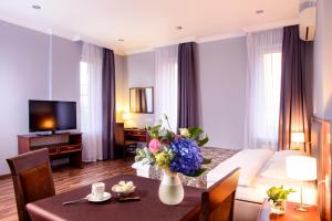 TV a/nebo společenská místnost v ubytování Greguar Hotel by UHM