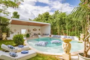 a pool in the backyard of a house at 4BR Villa for Families - 5 Min to Thomas Beach in Ungasan