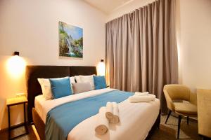 Postel nebo postele na pokoji v ubytování Azura Boutique Hotel + 129 fotografií