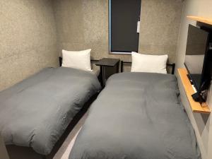 Postel nebo postele na pokoji v ubytování B-sum IS1