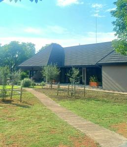 a building with a fence in front of it at Fikani game lodge in Thabazimbi