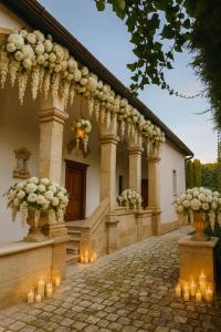 a building with candles and flowers in vases at Royal Transylvanian Castle - near Banffi in Gherla