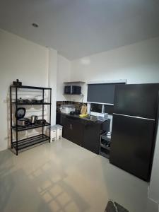 Kuchyň nebo kuchyňský kout v ubytování Pattiya House