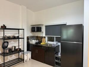 Kuchyň nebo kuchyňský kout v ubytování Pattiya House