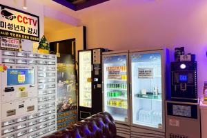 a room with two vending machines and a television at 3S HOTEL ANYANG 1st FASHION in Anyang