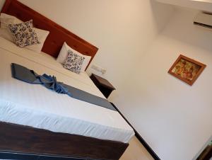 Una cama o camas en una habitación de Amelia resort