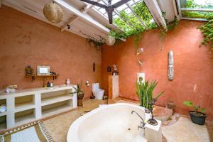 a large bathroom with a tub and a toilet at 4BR Villa for Families - 5 Min to Thomas Beach in Ungasan