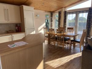 a kitchen and dining room with a table and chairs at Field View 2 bed - Hazel in Horham +9 photos