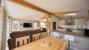 a living room with a couch and a table at Primrose 2 bed-No Pets-Daisy in Horham +11 photos