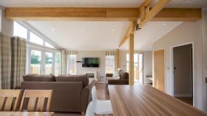 a living room with a couch and a table at Primrose 2 bed-No Pets-Daisy in Horham