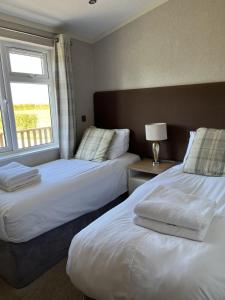 Ένα ή περισσότερα κρεβάτια σε δωμάτιο στο Primrose 3 bed - Poppy