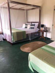 Ένα ή περισσότερα κρεβάτια σε δωμάτιο στο Rathkarawwa Heights