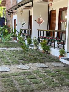 ゼネラル・ルナにあるJmt Star's Innの鉢植えの家