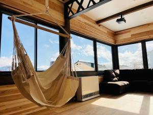 Posezení v ubytování KONAYUKI Apartment Myoko + 33 fotografií