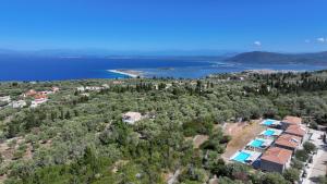 an aerial view of a resort and a lake at Ionian Harmony in Tsoukaladhes +2 photos