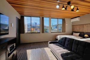 Postel nebo postele na pokoji v ubytování 又楽坊 Matarakubo