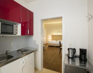 Kuchyň nebo kuchyňský kout v ubytování Apartment Nestroygasse