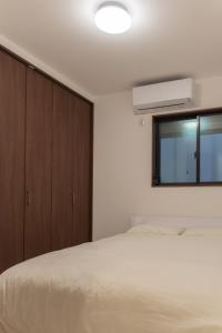 En eller flere senge i et værelse på 똘이하우스 모모다니