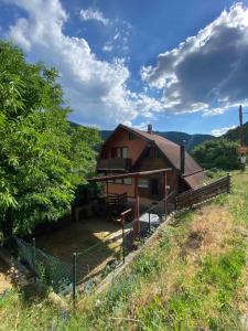 a house sitting on top of a hill at Apartmani Stajko in Crni Vrh