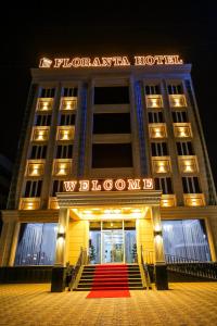 a hotel with a red carpet in front of it at Floranta Hotel in Qarshi