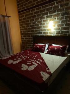 Ένα ή περισσότερα κρεβάτια σε δωμάτιο στο Residence Kuyito 2 Kahone +6 φωτογραφίες