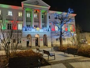 a building with christmas lights in front of it at Paris Rooms -Rynek Centrum -F VAT in Kielce