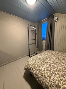 Ένα ή περισσότερα κρεβάτια σε δωμάτιο στο Above The Arctic circle