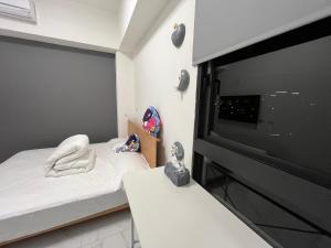 Postel nebo postele na pokoji v ubytování 5920電梯民宿