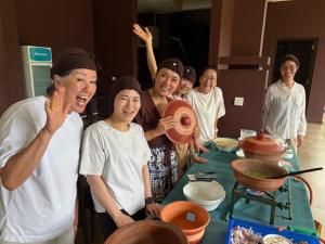 a group of people standing around a table with food at Celestia Ayurveda Resort in Bentota +114 photos