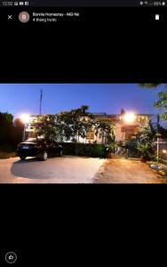 a car parked in a parking lot at night at BONNIE HOMESTAY Mui Ne in Mui Ne +160 photos