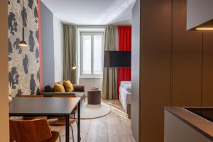 a living room with a couch and a table at my Home in Vienna - Erdberg Smart Apartments in Vienna