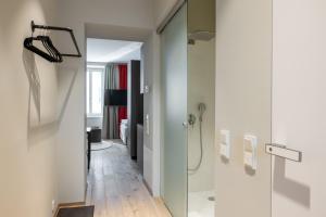 a bathroom with a shower and a glass door at my Home in Vienna - Erdberg Smart Apartments in Vienna +215 photos