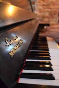 a close up of a piano keyboard at Liberum Residence Old Town in Gdańsk +48 photos