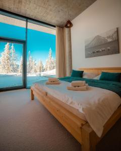 Ένα ή περισσότερα κρεβάτια σε δωμάτιο στο Apartmány PANORAMA Bachledka