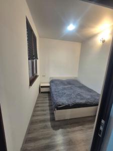 a bedroom with a bed and a window at Olive Home in Yerevan