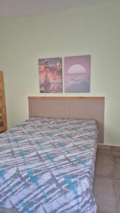 Postel nebo postele na pokoji v ubytování Suites Aconchegantes - Casa da Villa Bertioga + 6 fotografií