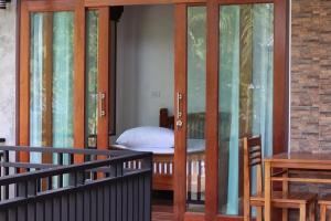 Postel nebo postele na pokoji v ubytování Baan Phangan