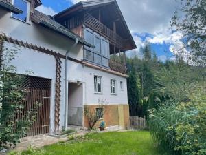 a large white house with a yard at Haus Leiner 