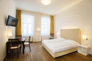 Postel nebo postele na pokoji v ubytování Apartment Nestroygasse