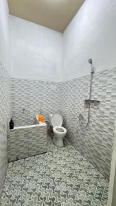 Koupelna v ubytování Homey Guesthouse Gubeng Syariah