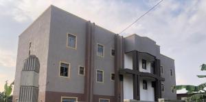 a building with a tower on the side of it at Kent One Hotel in Fort Portal +14 photos