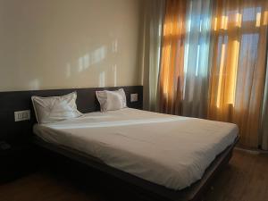 Ένα ή περισσότερα κρεβάτια σε δωμάτιο στο Hotel Narayan Palace