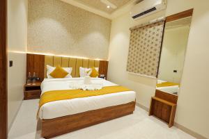 Postel nebo postele na pokoji v ubytování THE TAJ PEARL HOTEL + 196 fotografií