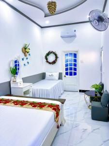 Una cama o camas en una habitación de Hoàng Nga 1 Homestay 86 fotos más