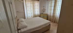 Ένα ή περισσότερα κρεβάτια σε δωμάτιο στο FERDİ KiRALAMA +34 φωτογραφίες