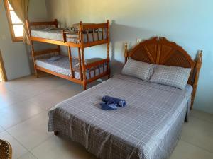 En eller flere senge i et værelse på Pousada Santa Rosa