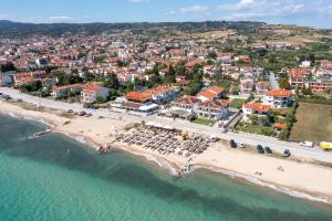 an aerial view of a beach in a resort at Assano Seafront Luxury in Nikiti